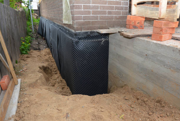 Happy homeowners after waterproofing job in Random Lake